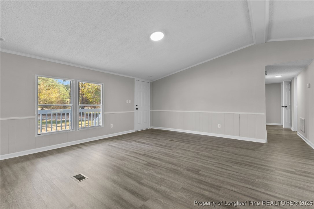5888 Butler Nursery Road Fayetteville, NC 28306 - Photo 22 of 42 wooden floor in an empty room with a window