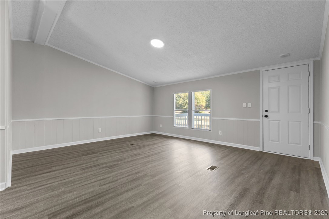 5888 Butler Nursery Road Fayetteville, NC 28306 - Photo 26 of 42 an empty room with wooden floor and windows