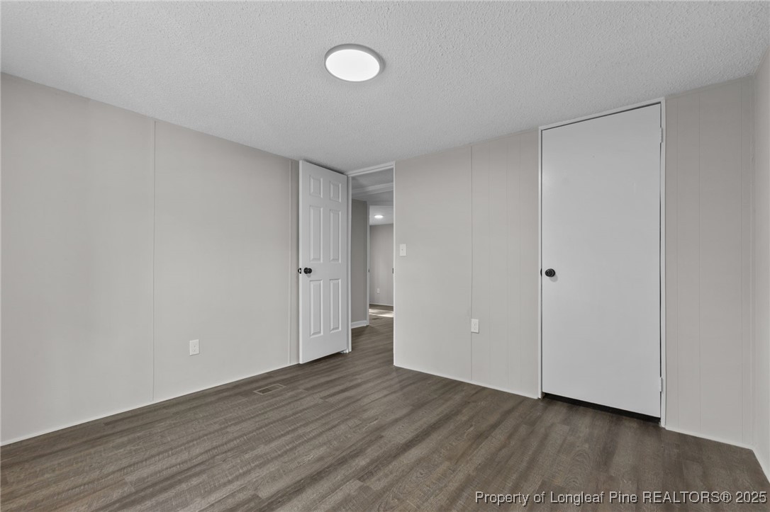 5888 Butler Nursery Road Fayetteville, NC 28306 - Photo 27 of 42 a view of an empty room with wooden floor