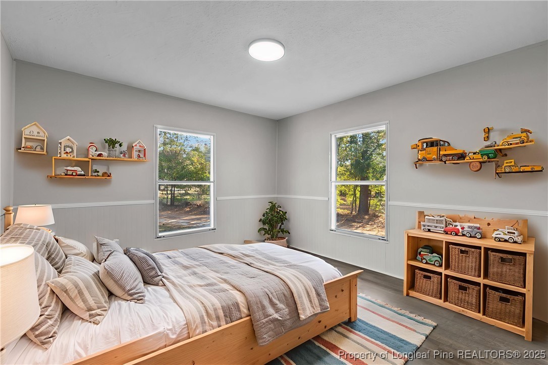 5888 Butler Nursery Road Fayetteville, NC 28306 - Photo 30 of 42 a bedroom with a bed and a window