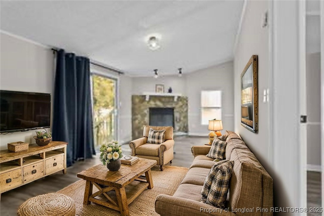 5888 Butler Nursery Road Fayetteville, NC 28306 - Photo 6 of 42 a living room with furniture and a flat screen tv