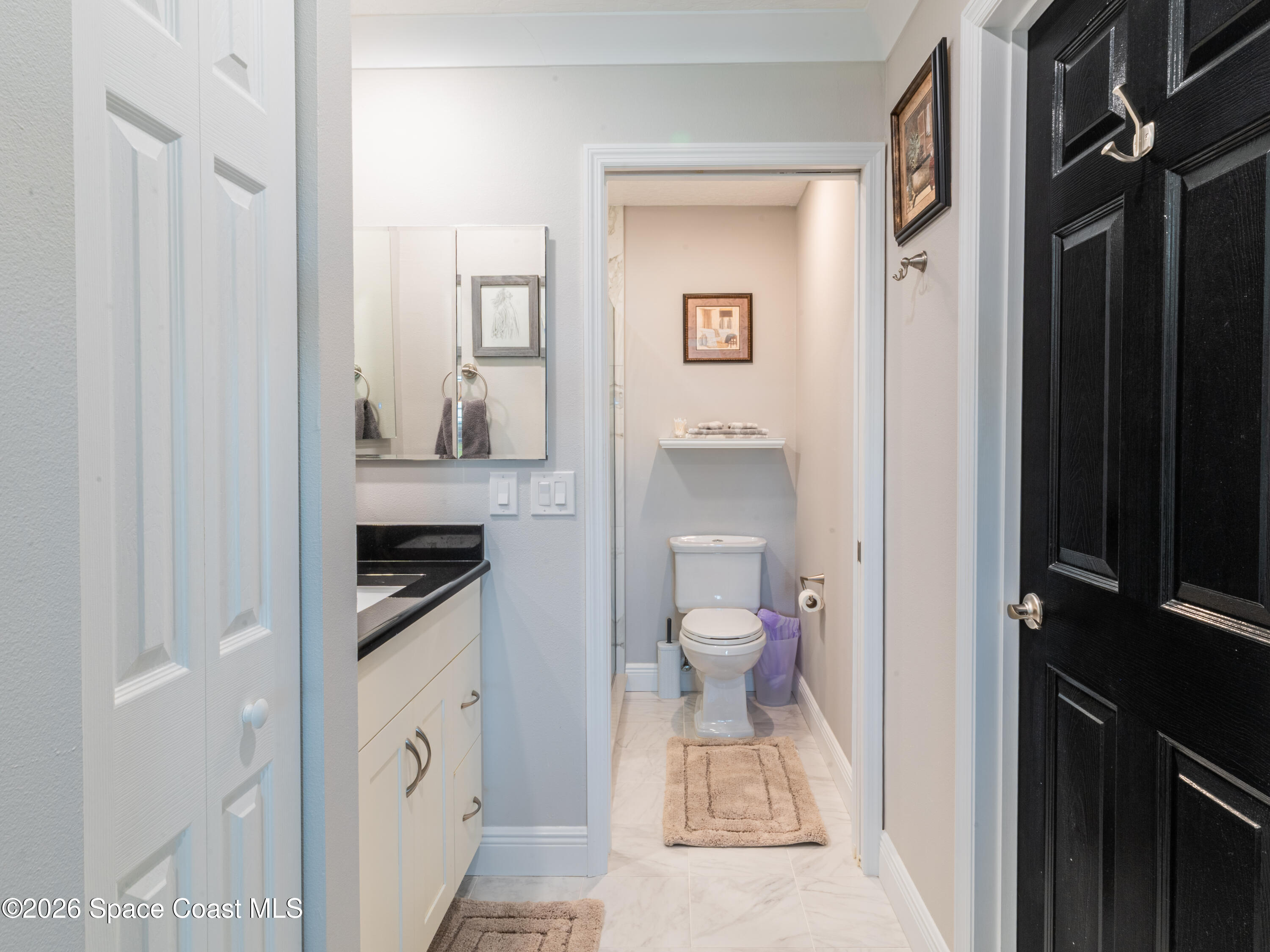 2727 North Wickham Road, Unit 2059 Melbourne, FL 32935 - Photo 17 of 32 Step in Closet to the Right