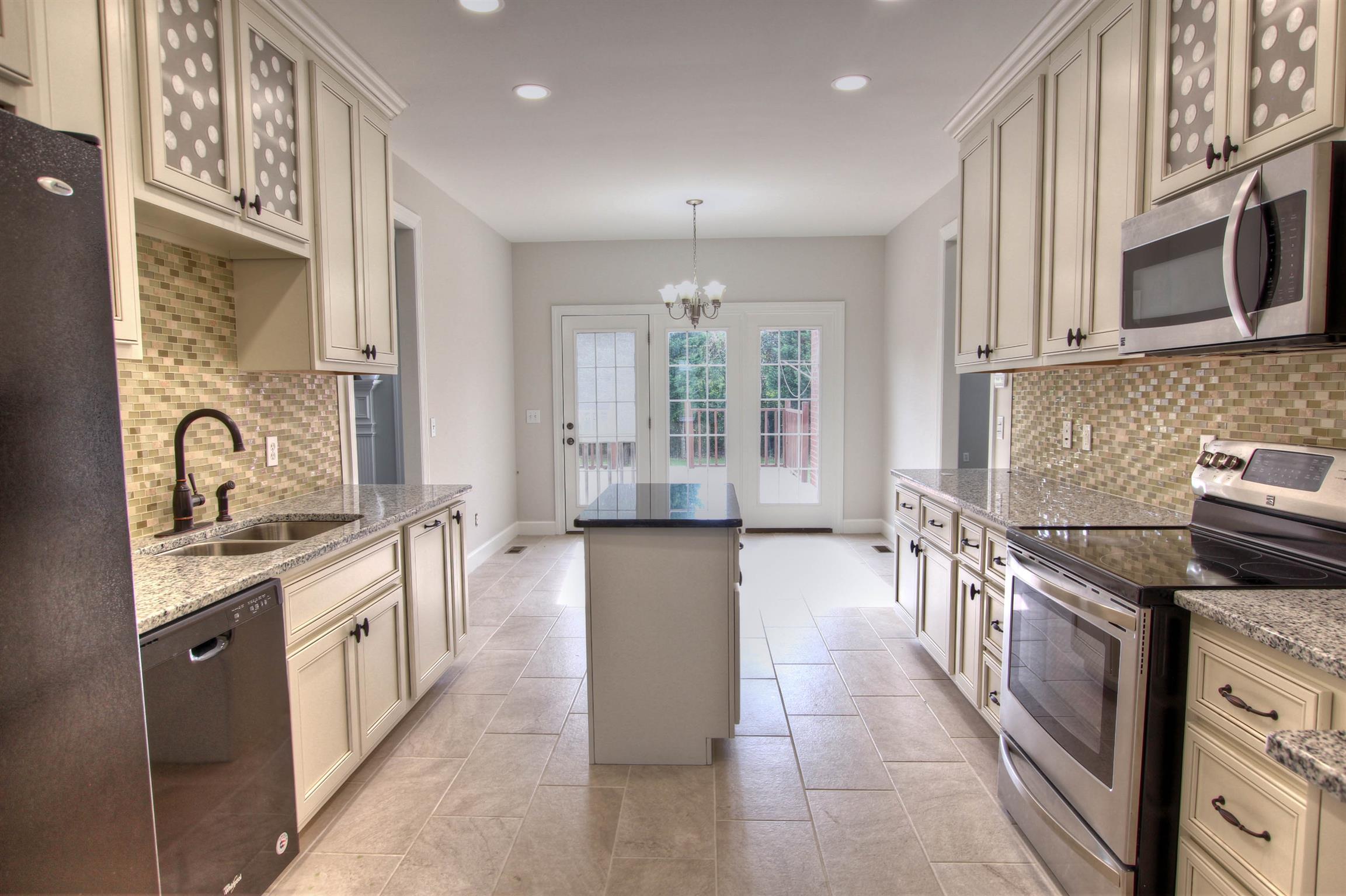 225 Conquest Road Murfreesboro, TN 37128 - Photo 6 of 21 Large kitchen with island and stainless steel appliances.
