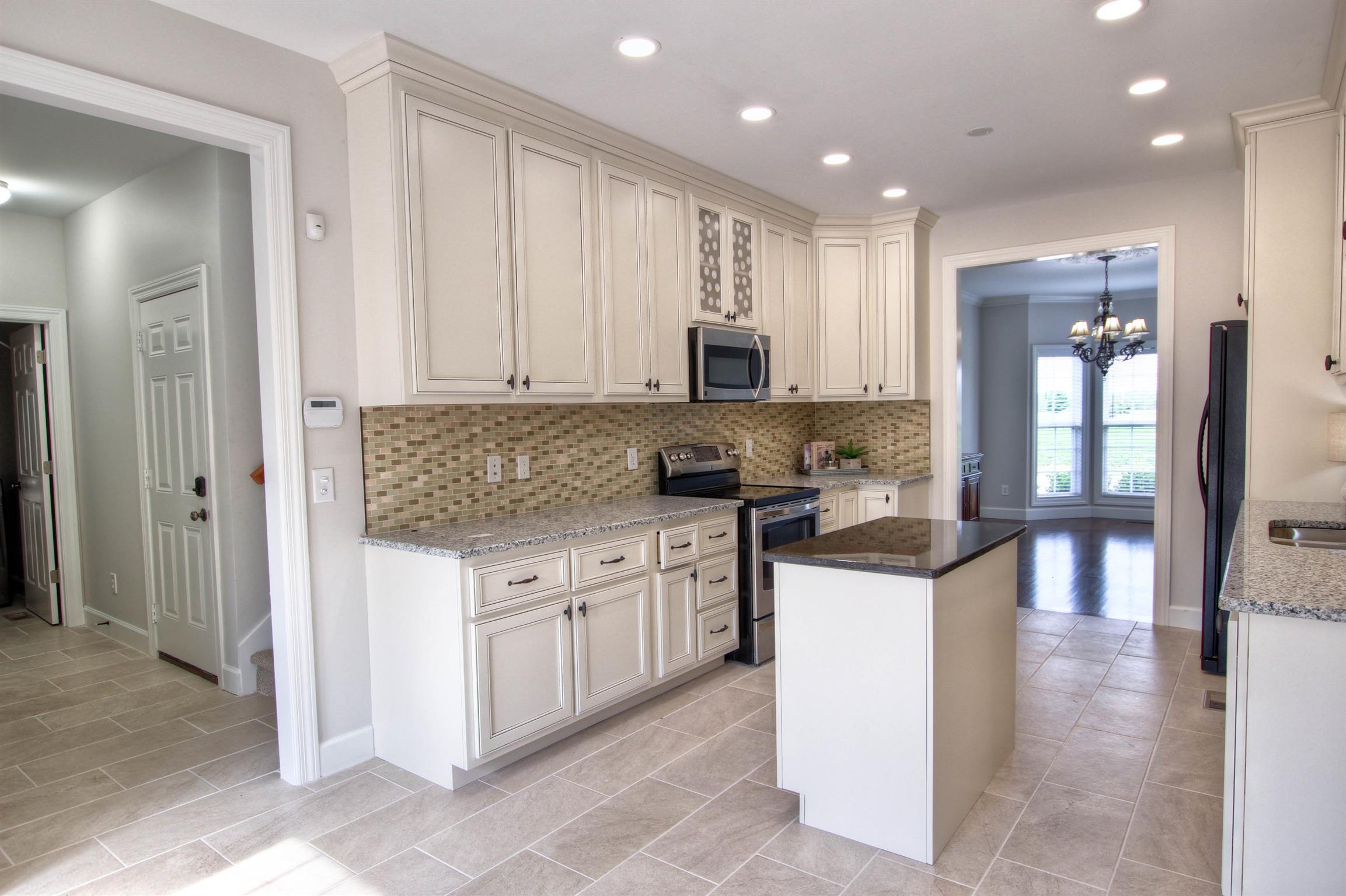 225 Conquest Road Murfreesboro, TN 37128 - Photo 7 of 21 Laundry room and pantry to left. Kitchen has new granite and cabinetry.
