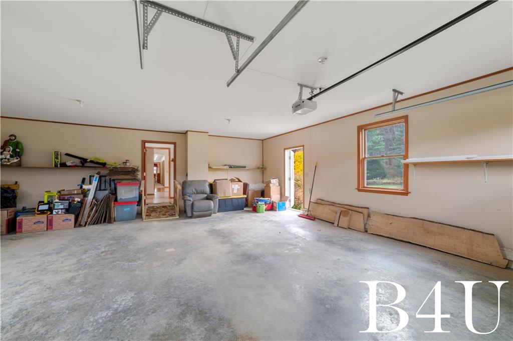 442 Fox Road Otego, NY 13825 - Photo 12 of 40 a view of a livingroom with furniture and a garage