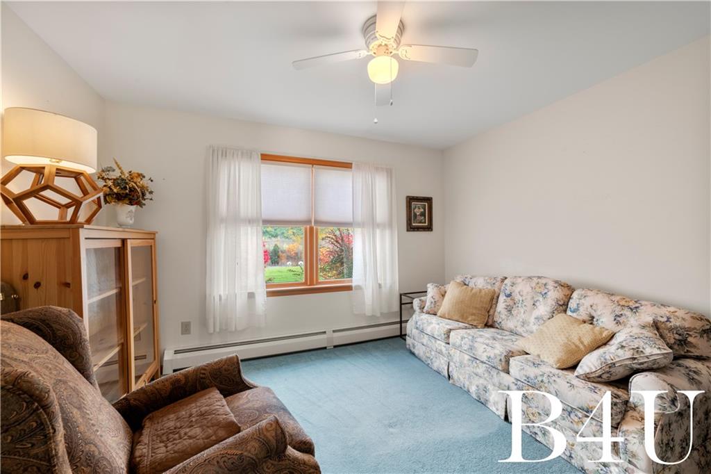 442 Fox Road Otego, NY 13825 - Photo 14 of 40 a living room with furniture and a window
