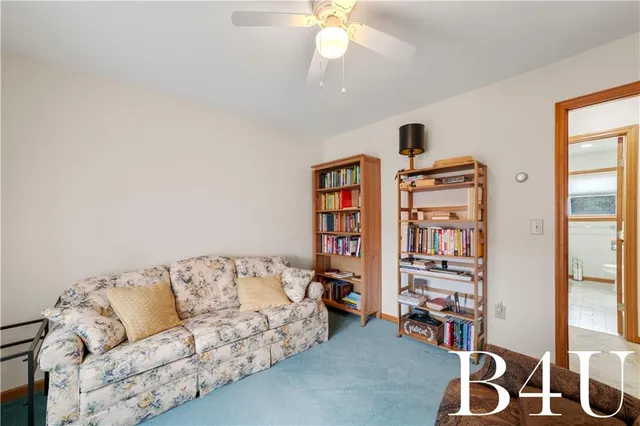 a en suite bathroom with a double vanity sink and a mirror