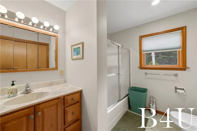 a bathroom with a tub and sink