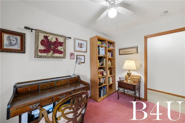 a lobby with furniture and floor to ceiling window