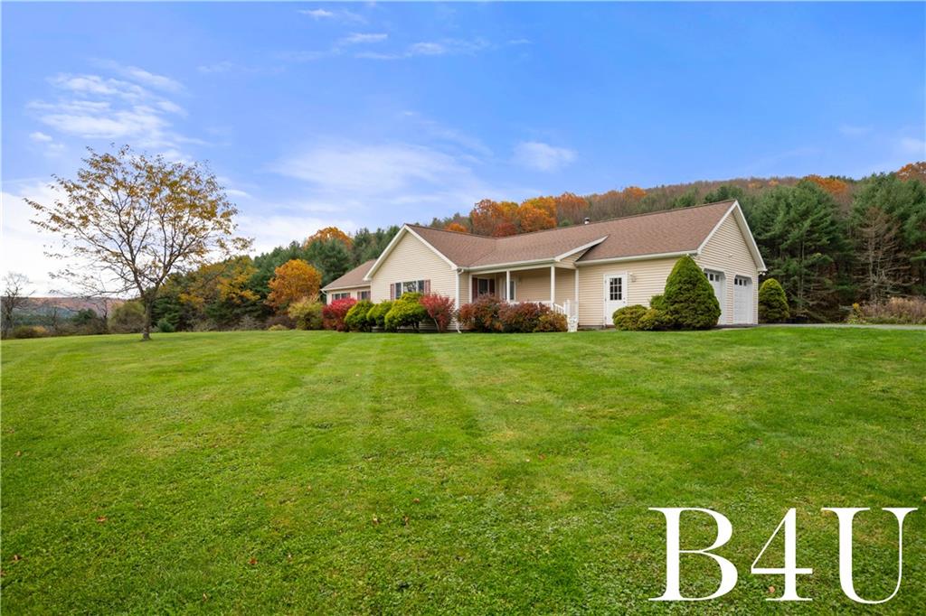442 Fox Road Otego, NY 13825 - Photo 2 of 40 a front view of house with garden
