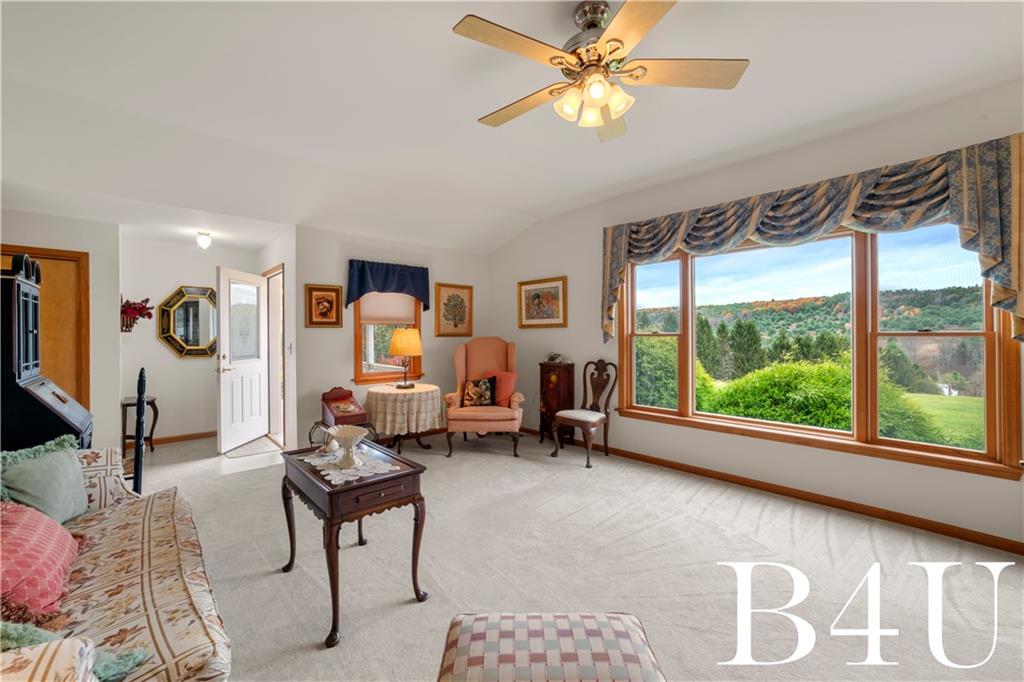 442 Fox Road Otego, NY 13825 - Photo 26 of 40 a living room with furniture and a large window