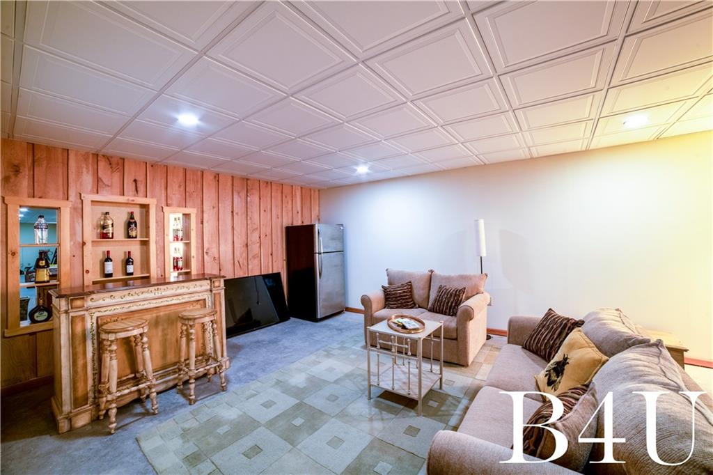 442 Fox Road Otego, NY 13825 - Photo 27 of 40 a living room with furniture and a kitchen