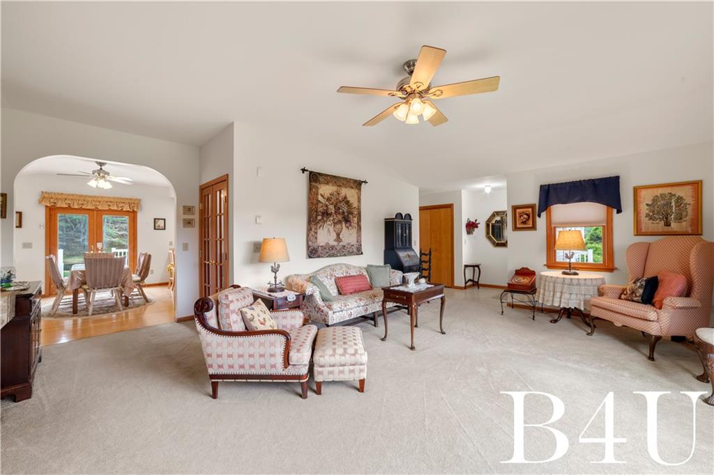 442 Fox Road Otego, NY 13825 - Photo 5 of 40 a living room with furniture and a chandelier