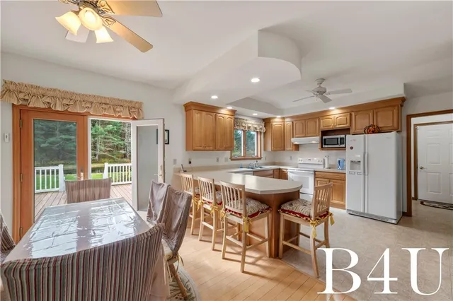 a view of a livingroom with furniture and a garage