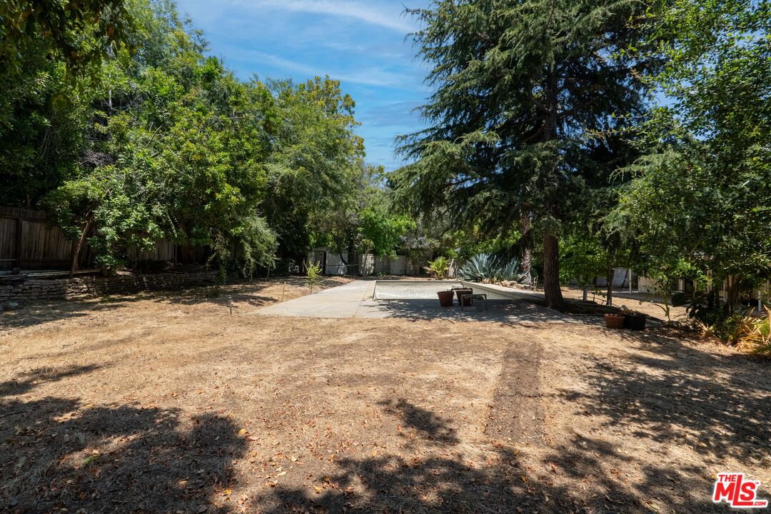 13657 Sunset Boulevard Pacific Palisades, CA 90272 - Photo 5 of 10 a view of backyard with large trees