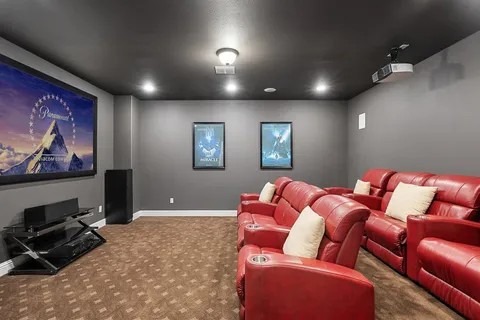 a living room with furniture a rug and a flat screen tv