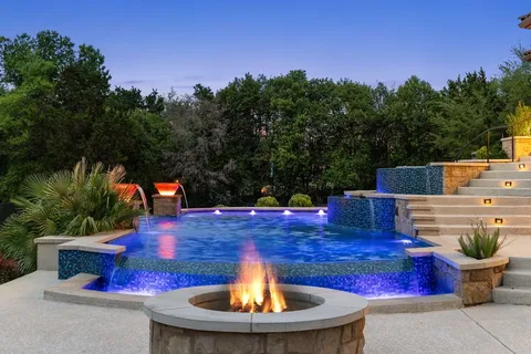 a view of a backyard with sitting area