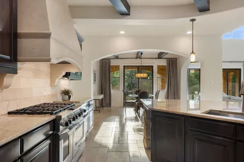 a kitchen with a stove and a sink