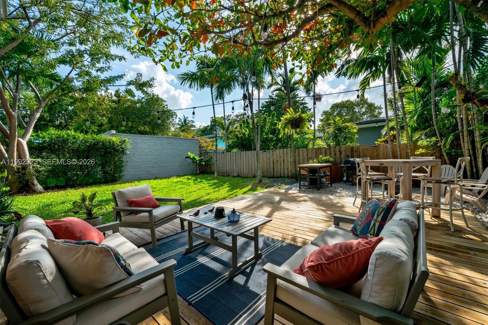 970 Northwest 10th Avenue Miami, FL 33136 - Photo 1 of 34 a view of a patio with couches chairs and a fire pit