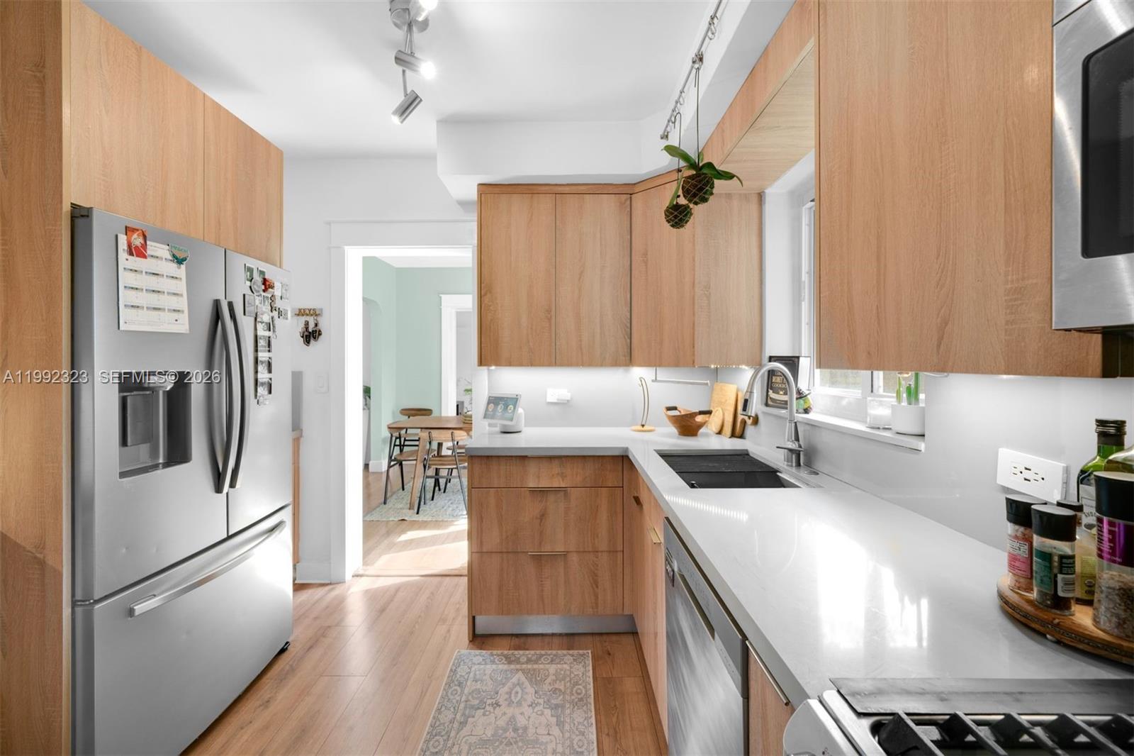 970 Northwest 10th Avenue Miami, FL 33136 - Photo 11 of 34 a kitchen with a refrigerator stove and sink