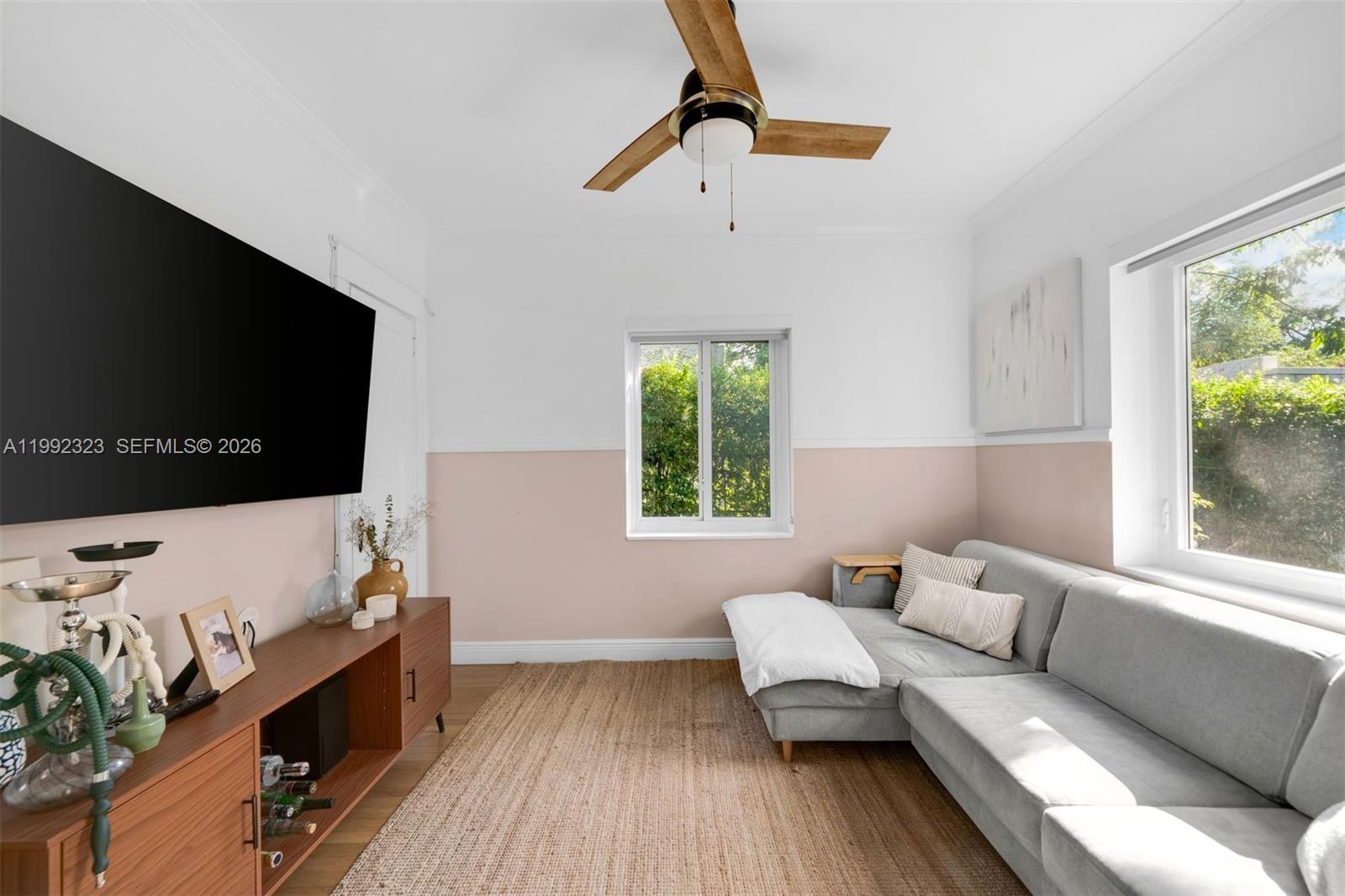 970 Northwest 10th Avenue Miami, FL 33136 - Photo 14 of 34 a living room with furniture and a flat screen tv