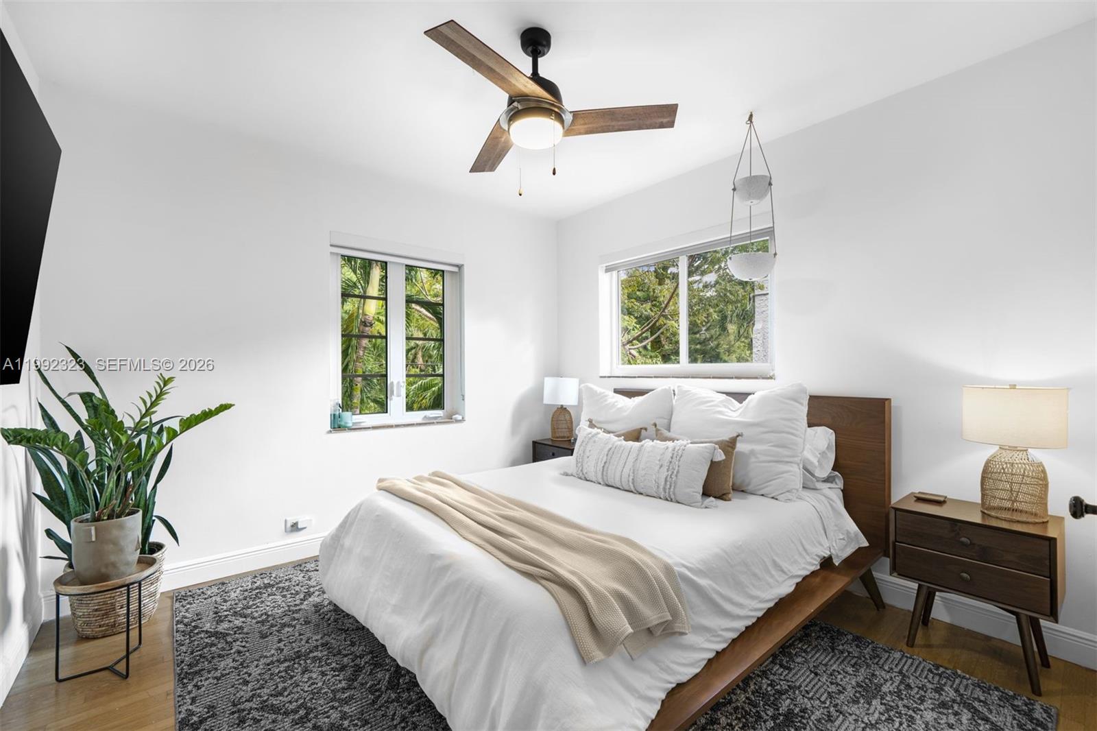 970 Northwest 10th Avenue Miami, FL 33136 - Photo 18 of 34 a bedroom with a bed a window and potted plant