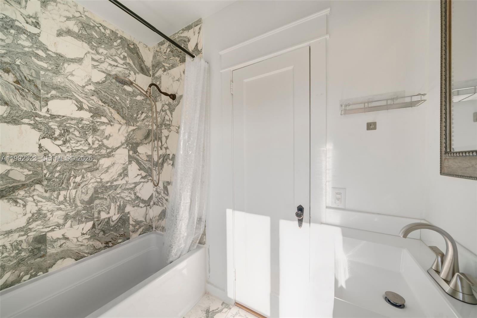 970 Northwest 10th Avenue Miami, FL 33136 - Photo 27 of 34 a bathroom with a bathtub and shower