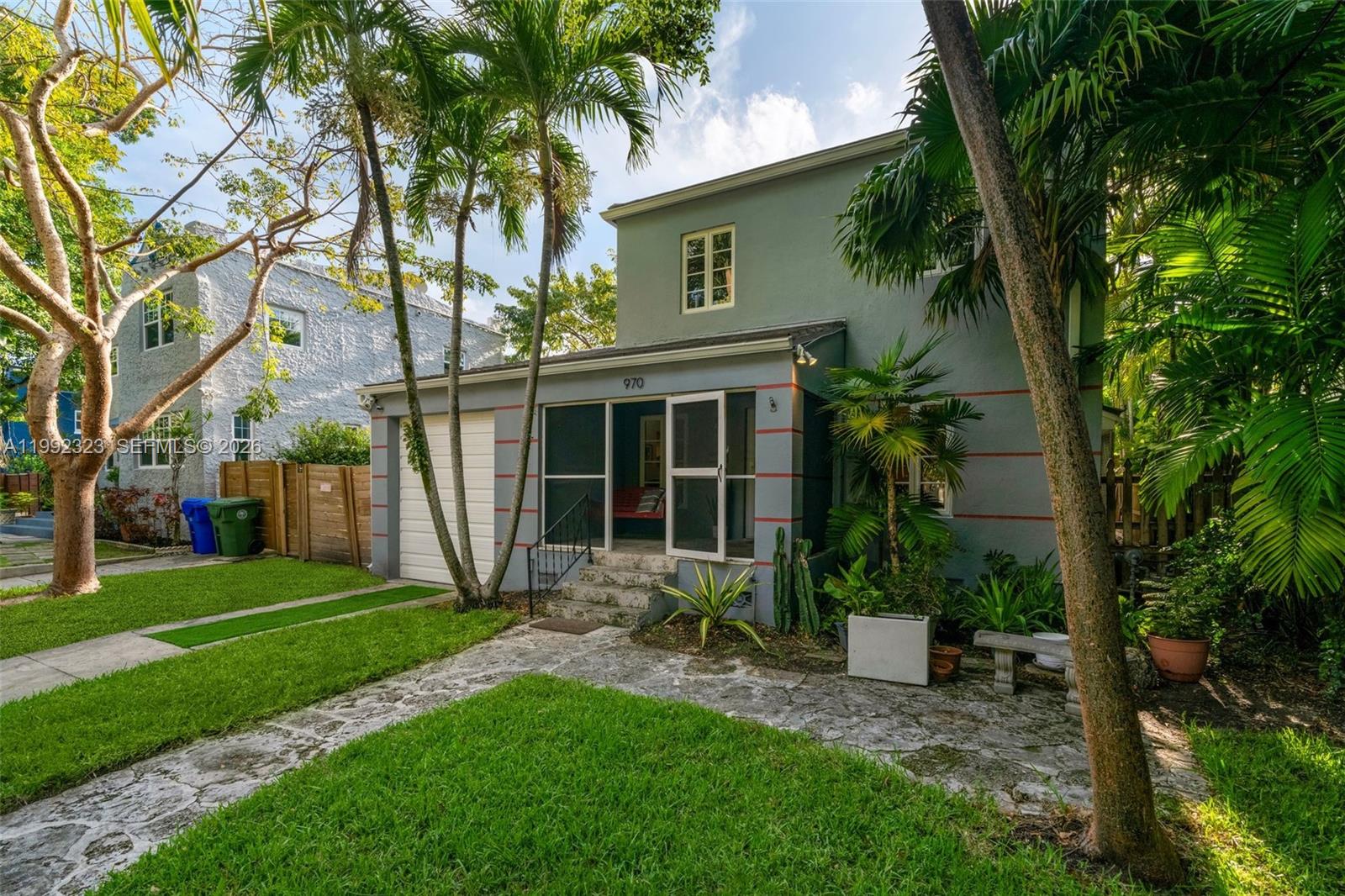 970 Northwest 10th Avenue Miami, FL 33136 - Photo 34 of 34 a view of a house with a yard and a large tree