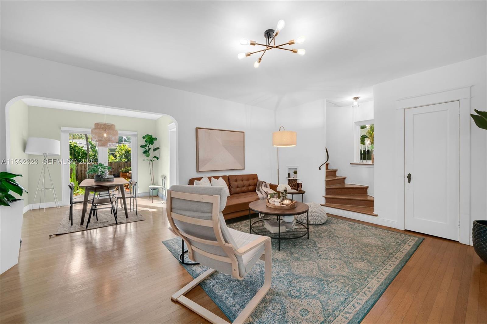 970 Northwest 10th Avenue Miami, FL 33136 - Photo 5 of 34 a living room with furniture or couch and a wooden floor