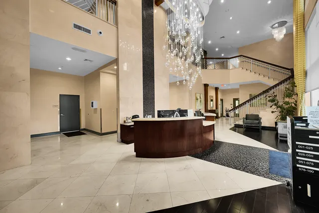 a bedroom with a bed and glass door