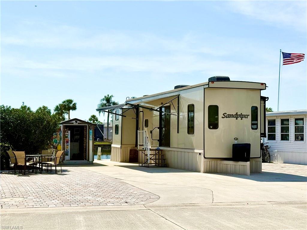 564 Cattleya Refuge, Unit 564 Naples, FL 34114 - Photo 1 of 50 a front view of a house with a porch