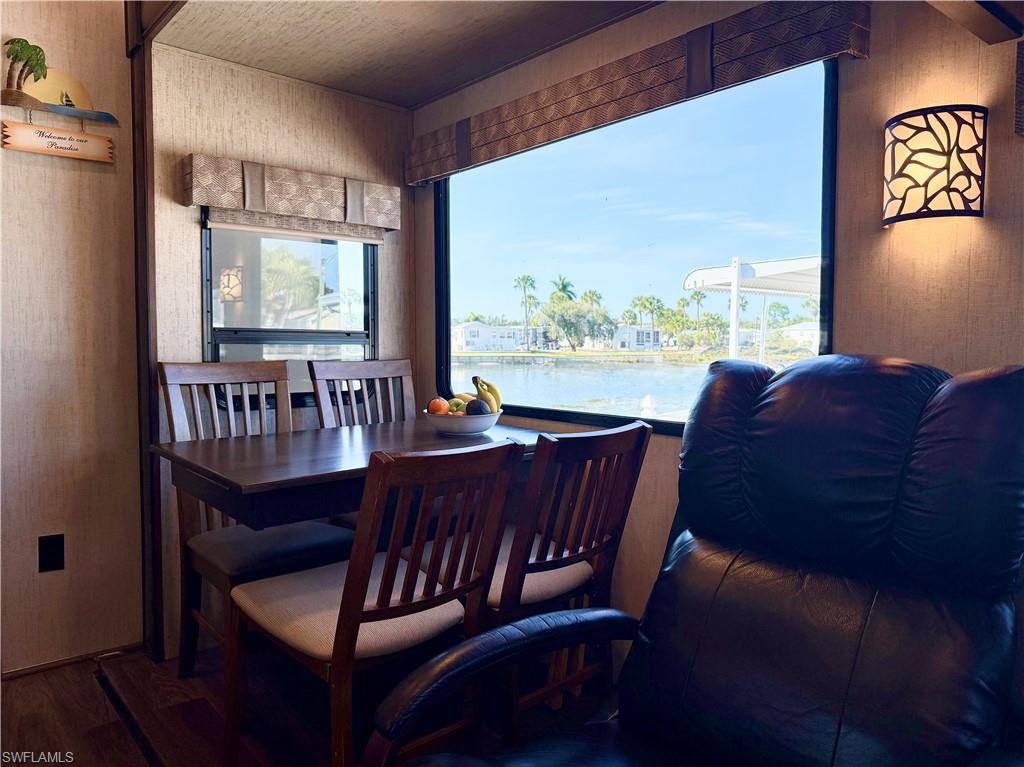 564 Cattleya Refuge, Unit 564 Naples, FL 34114 - Photo 22 of 50 a view of a dining room with furniture window and outside view