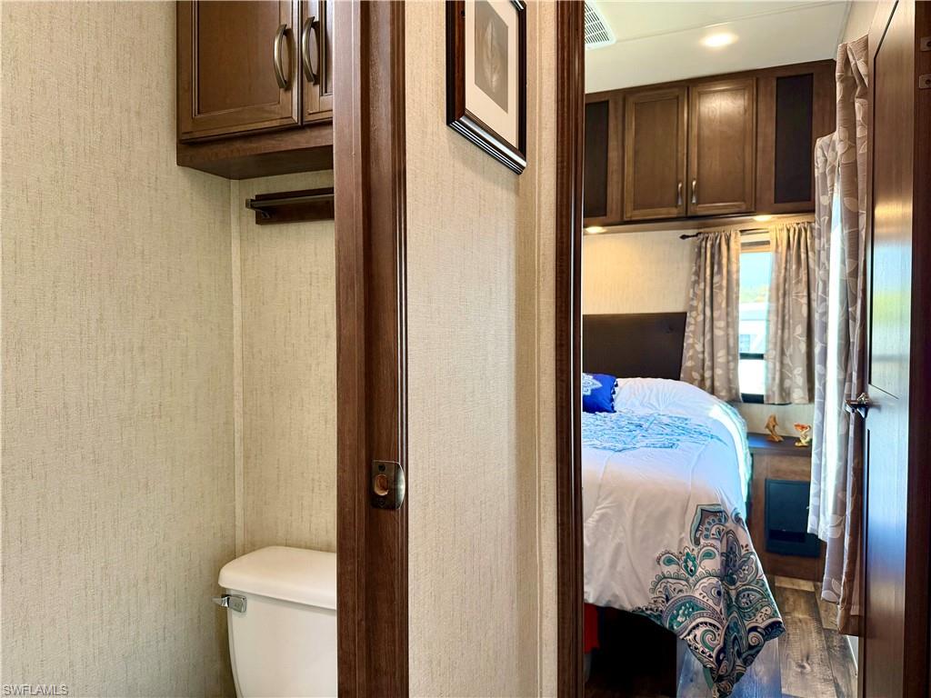 564 Cattleya Refuge, Unit 564 Naples, FL 34114 - Photo 29 of 50 a bathroom with a toilet sink and tub