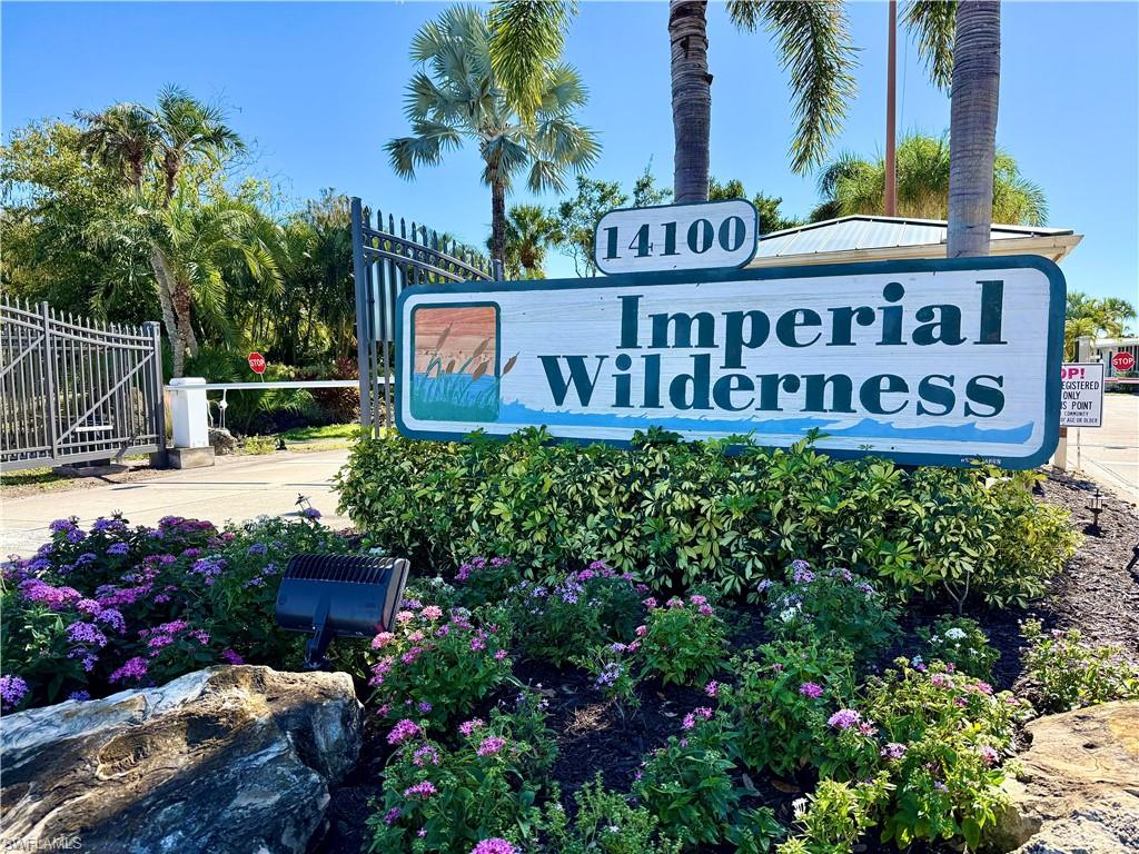 564 Cattleya Refuge, Unit 564 Naples, FL 34114 - Photo 43 of 50 a view of sign board with buildings in background