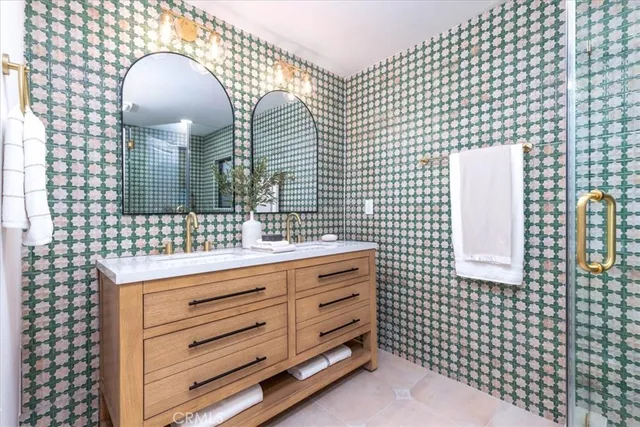 a bathroom with a sink a vanity and a mirror