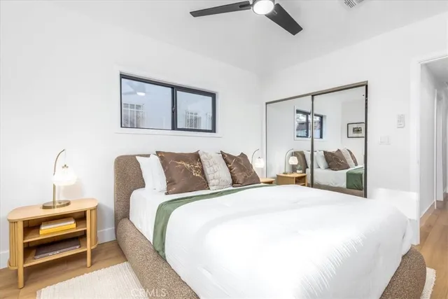 a bedroom with a bed and a couch