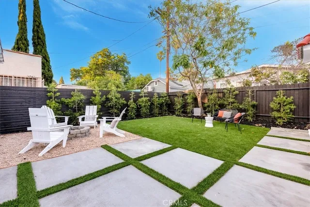 a view of a backyard with sitting area