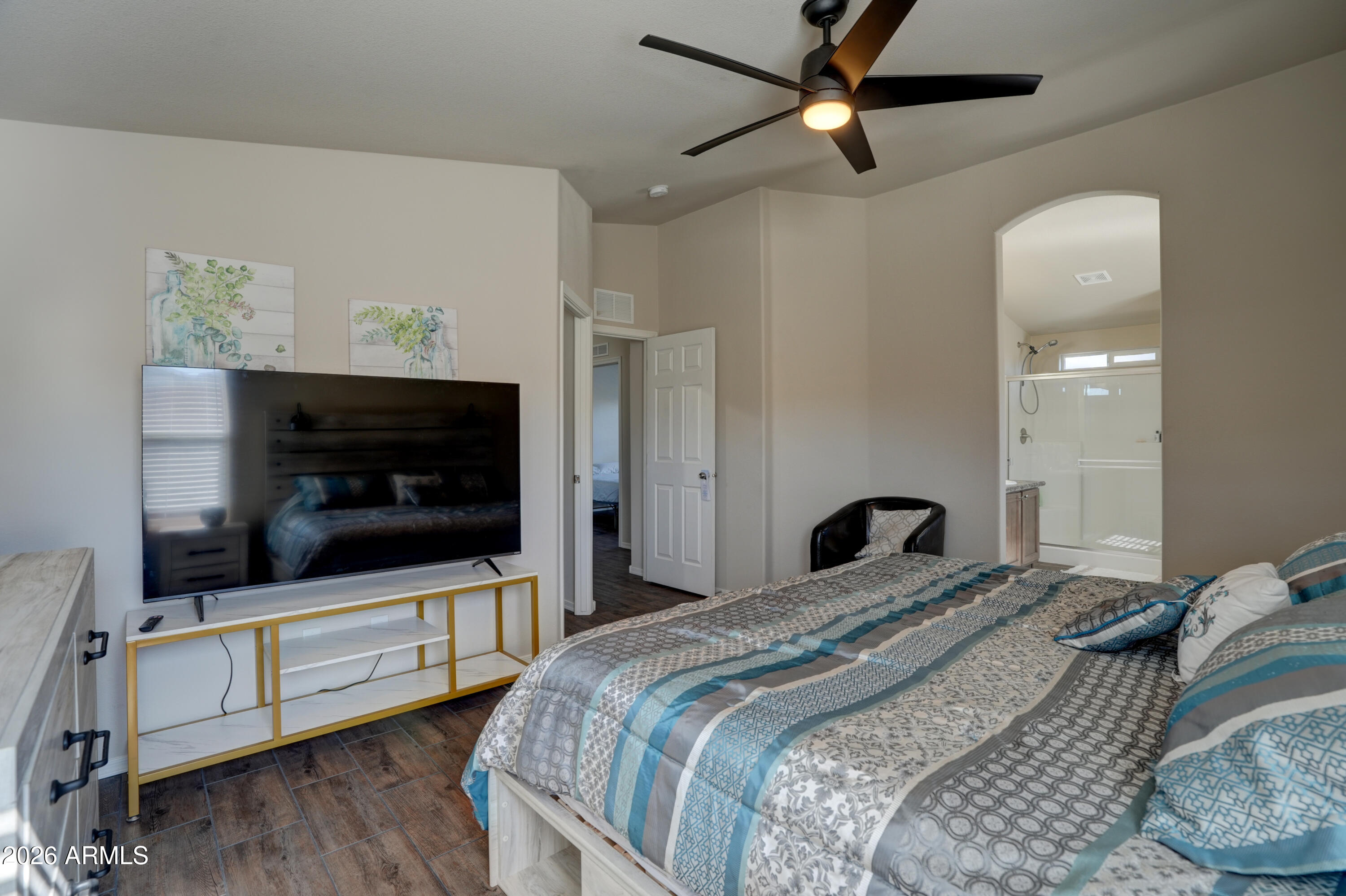 1159 Wheeler Road Camp Verde, AZ 86322 - Photo 11 of 13 a bedroom with a bed and a flat screen tv