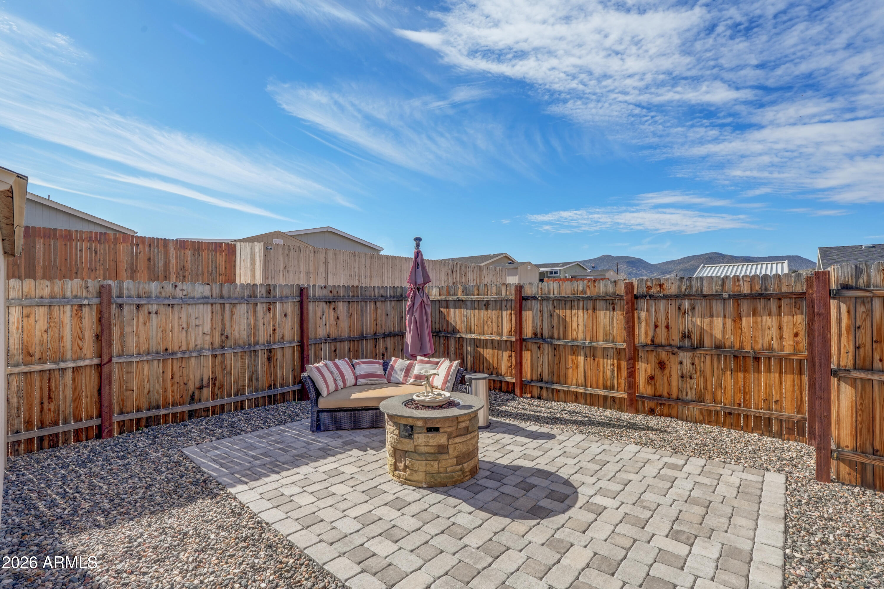 1159 Wheeler Road Camp Verde, AZ 86322 - Photo 4 of 13 a chair and table sitting in backyard of a house