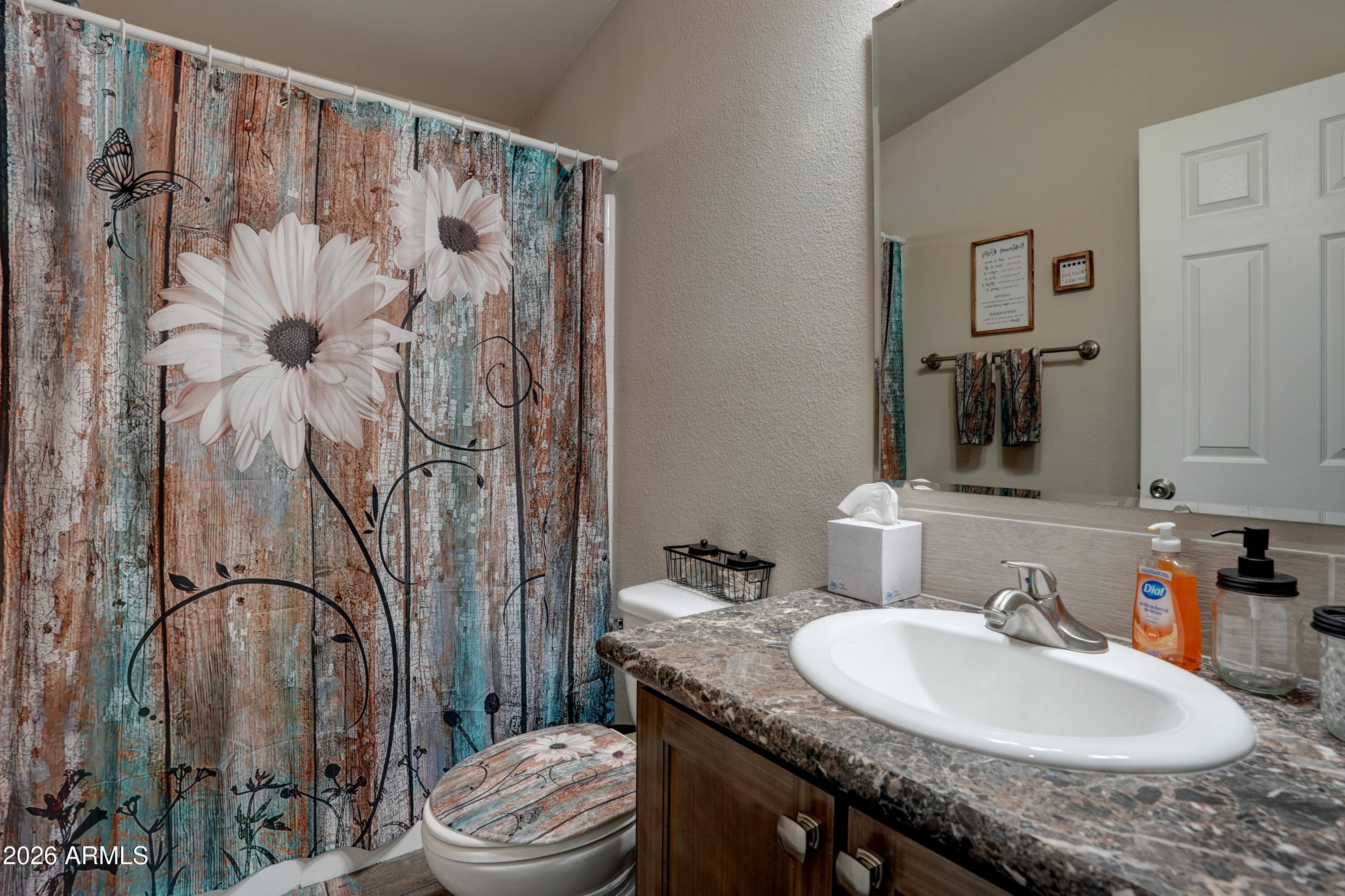 1159 Wheeler Road Camp Verde, AZ 86322 - Photo 6 of 13 a bathroom with a granite countertop sink a toilet and a mirror