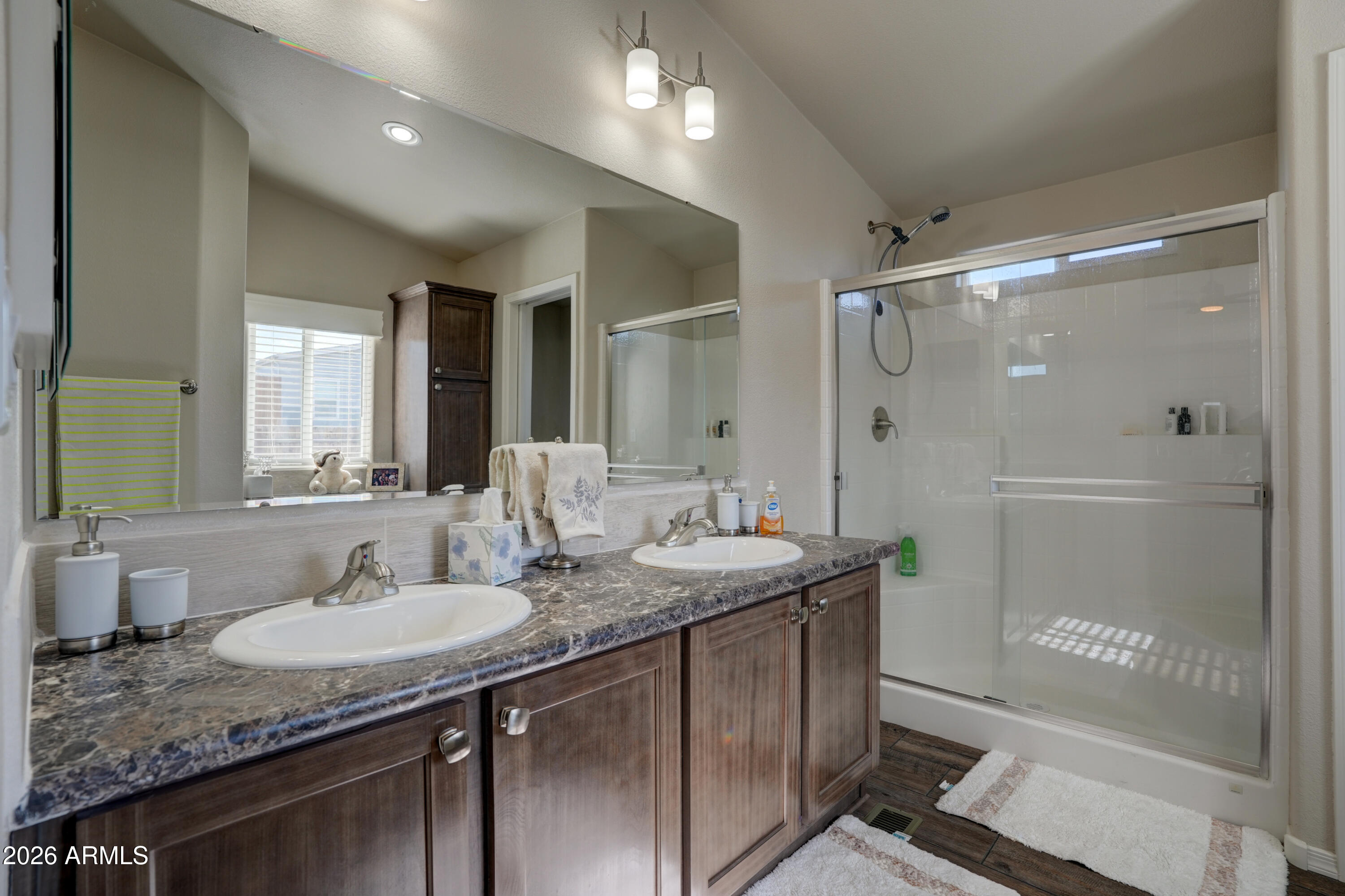 1159 Wheeler Road Camp Verde, AZ 86322 - Photo 10 of 13 a bathroom with a granite countertop sink mirror and a shower