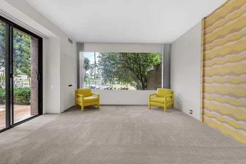 a bathroom with a double vanity sink mirror and shower