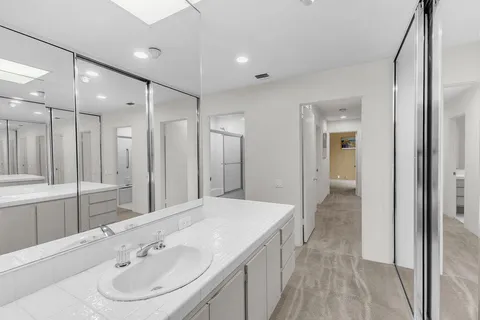 a bathroom with a glass shower door