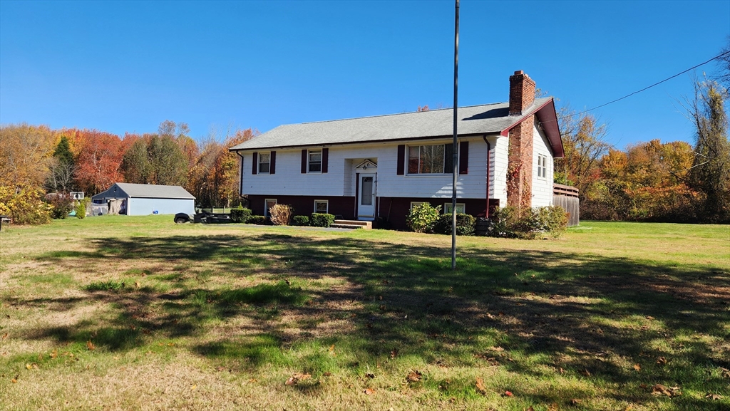 62 Millville Road Mendon, MA 01756 - Photo 2 of 10 a view of a house with a big yard