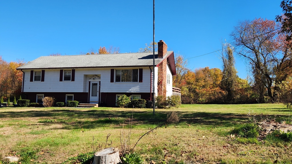 62 Millville Road Mendon, MA 01756 - Photo 8 of 10 a front view of a house with a yard