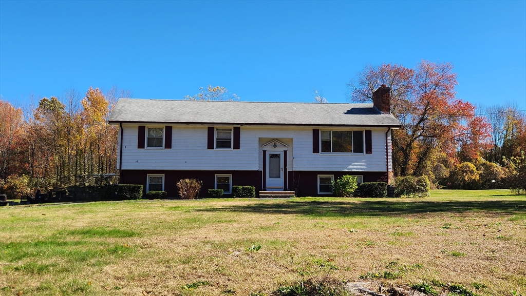 62 Millville Road Mendon, MA 01756 - Photo 9 of 10 a front view of a house with a yard