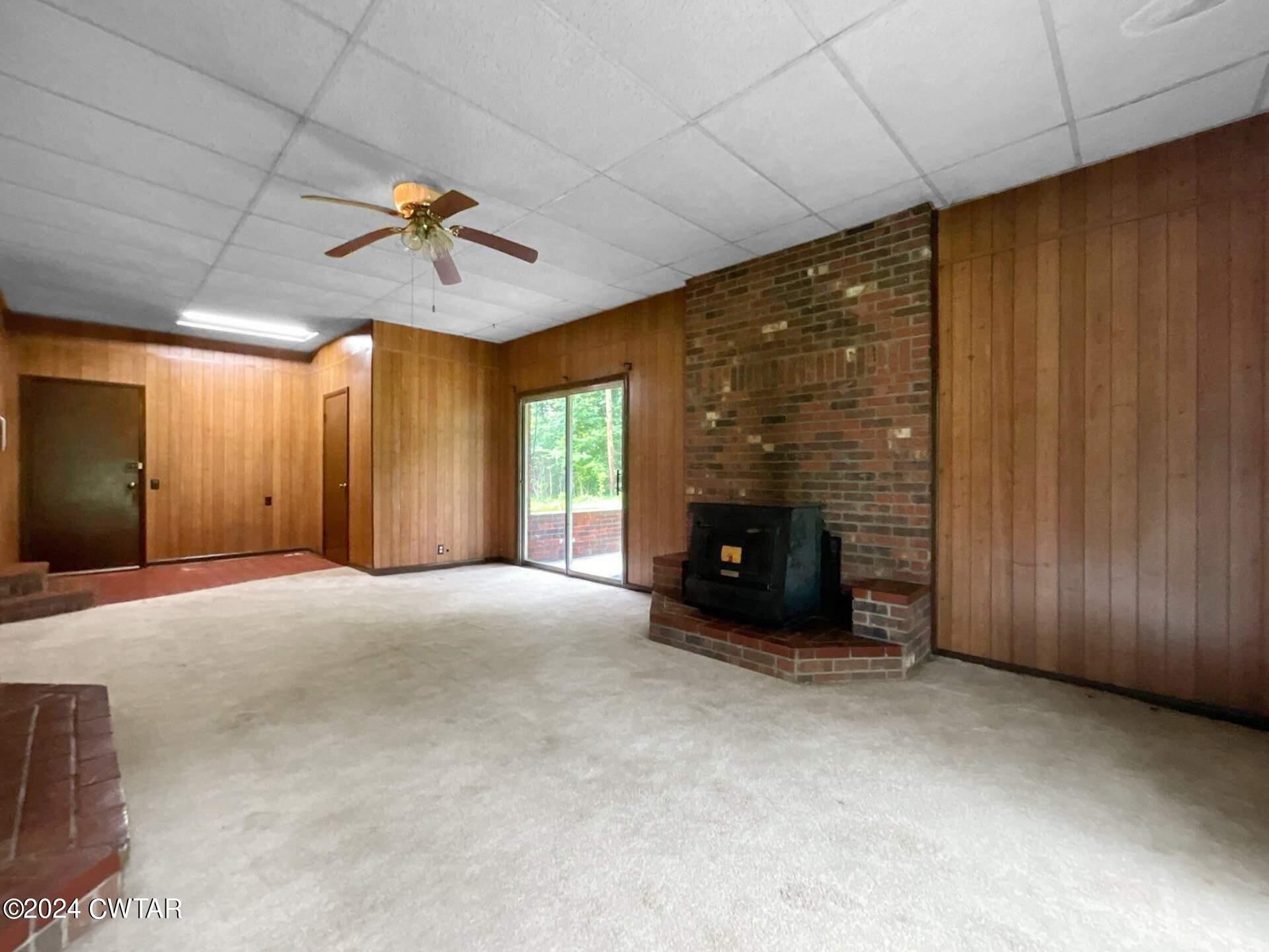 1255 Westport Road Huntingdon, TN 38344 - Photo 13 of 27 a view of an empty room with a fireplace