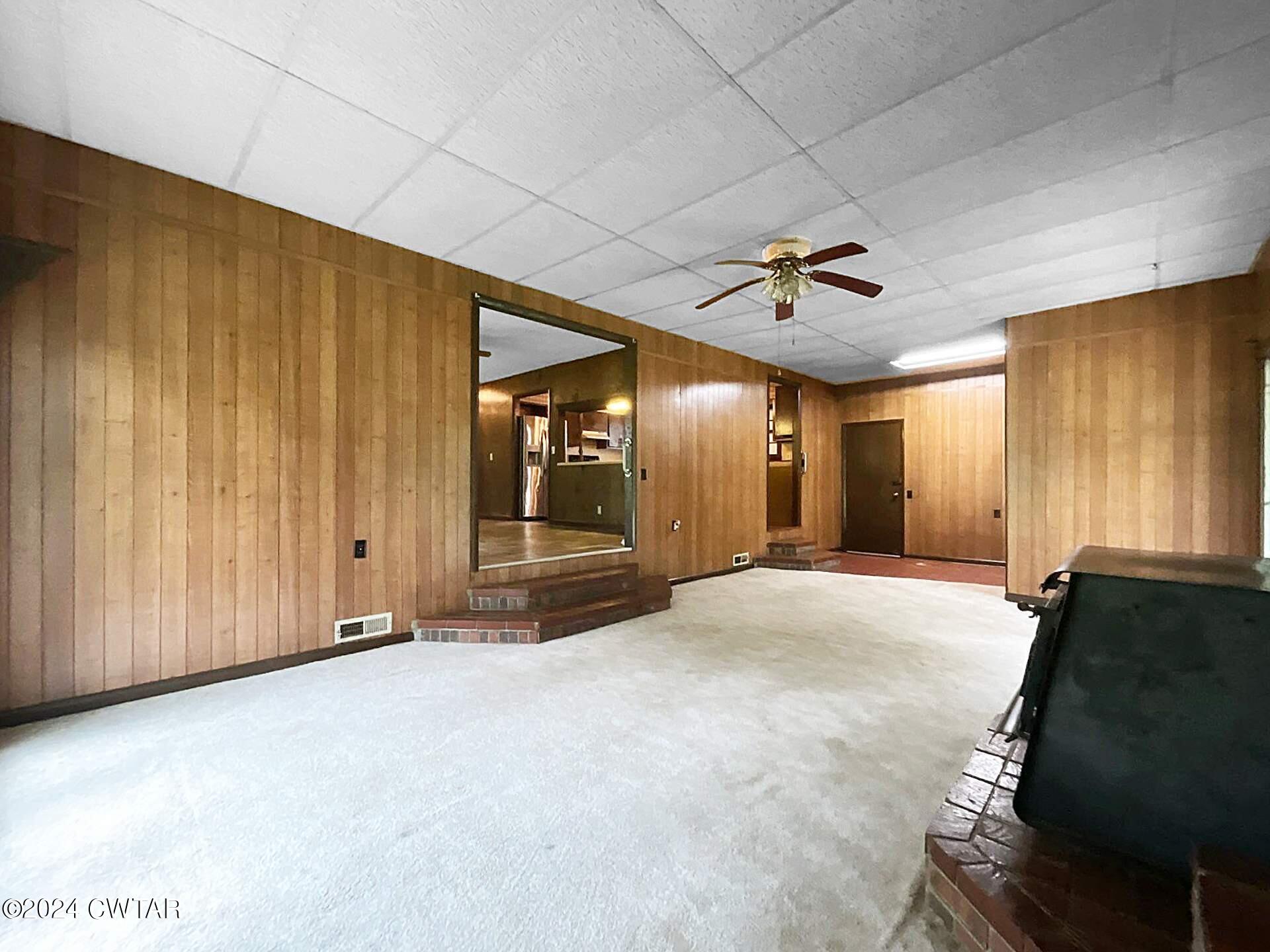 1255 Westport Road Huntingdon, TN 38344 - Photo 14 of 27 a view of a livingroom with a ceiling fan and window