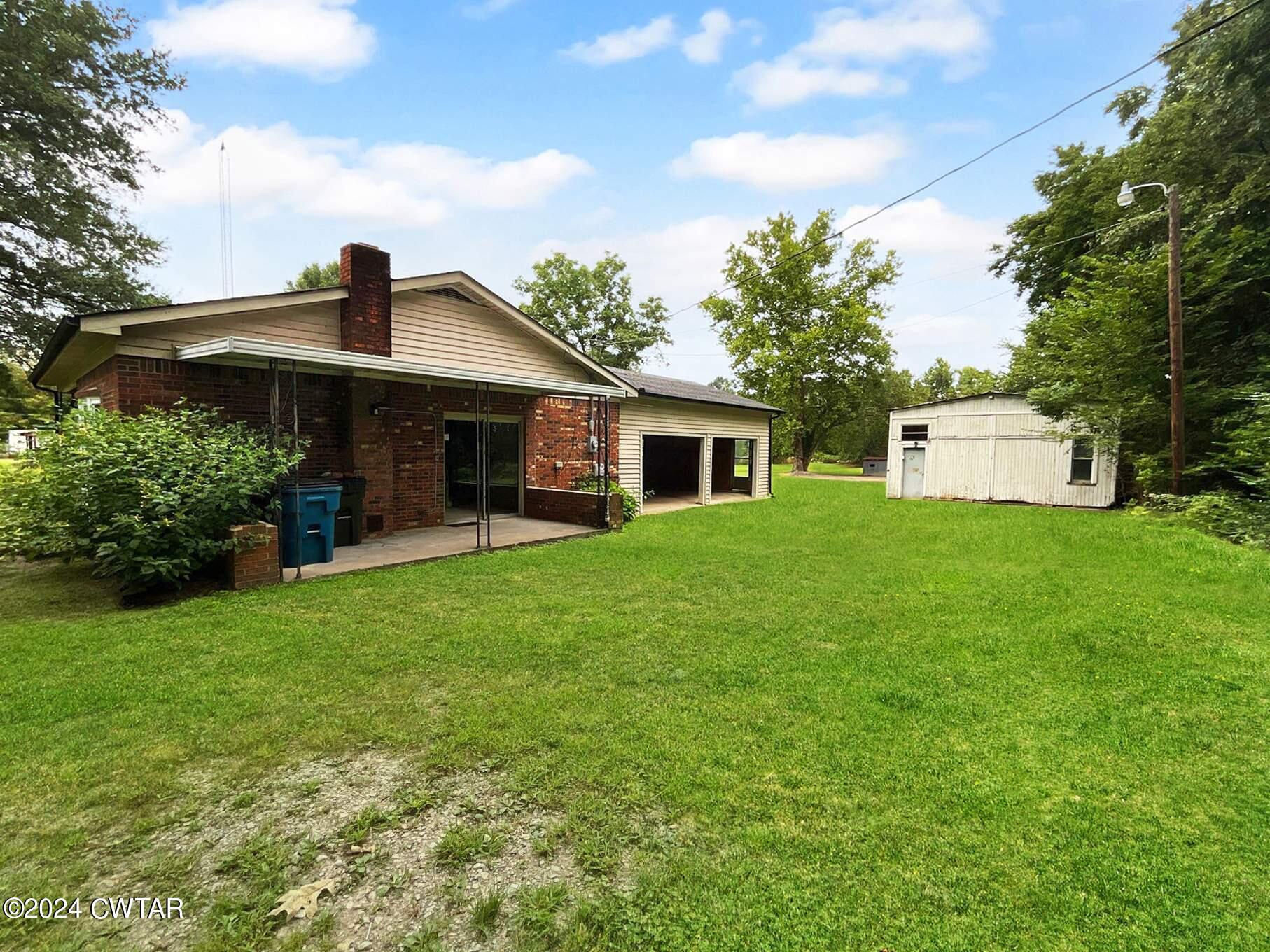 1255 Westport Road Huntingdon, TN 38344 - Photo 2 of 27 a front view of house with yard and green space