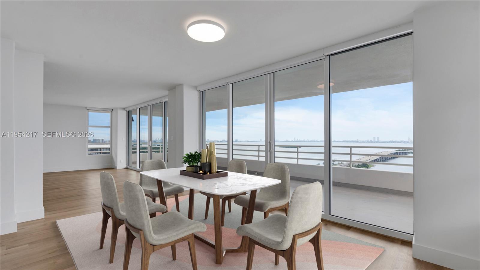 555 Northeast 34th Street, Unit 2201 Miami, FL 33137 - Photo 12 of 46 a view of a dining room with furniture window and outside view